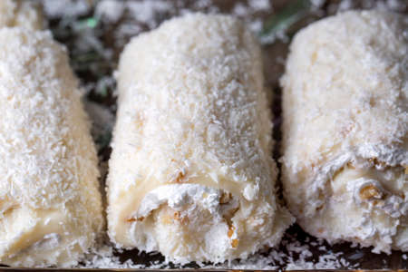 Turkish delight with coconut on a wooden background. Selective focus.の写真素材