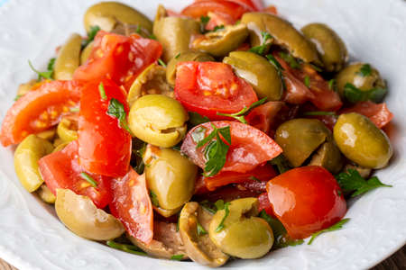 Gourmet flavors from traditional Turkish cuisine; green olive salad (Turkish name; Kirma yesil olive salatasi) A flavor belonging to the Turkey - Antakya region.の写真素材