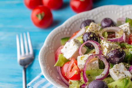 Greek salad with fresh vegetables, feta cheese and kalamata olives. Healthy food.の写真素材