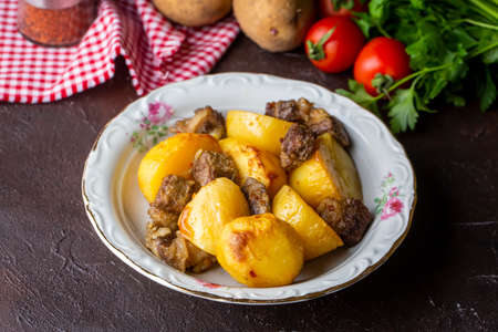 From traditional delicious Turkish food; potato and meat dish in casserole (Turkish name; Guvec tas kebabi, tandir)の写真素材