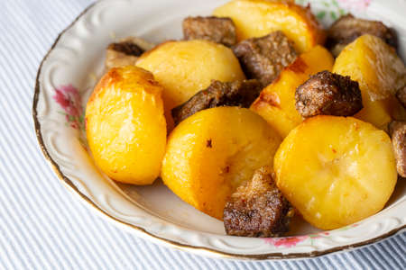 From traditional delicious Turkish food; potato and meat dish in casserole (Turkish name; Guvec tas kebabi, tandir)の写真素材
