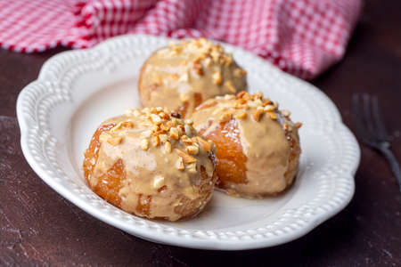 Traditional delicious Turkish dessert; Tahini and hazelnuts on Kemalpasa dessertの写真素材
