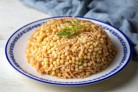 Traditional delicious Turkish food; Couscous pilaf with vermicelli (Turkish name; Couscous pilavi...