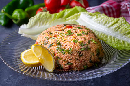 Tabbouleh, a traditional Arabic dish made of bulgur, tomatoes, parsley, and mint.の写真素材