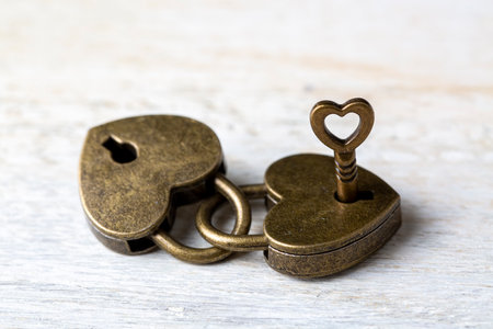 Heart shaped padlock on a wooden background. Valentine's day concept.の写真素材