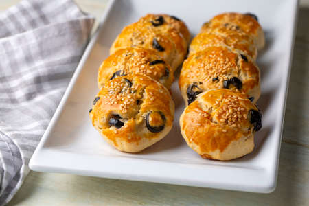Turkish style pastry with olives (Turkish name; pogaca with olives)