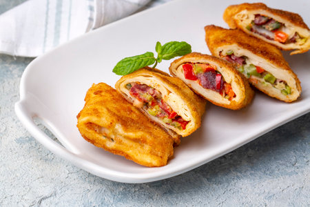 Turkish Pacanga Boregi with pastirma (pastrami) and cheddar (melted) cheese. - Pastrami Borek