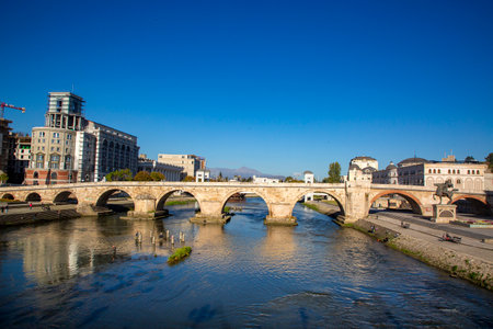 Skopje - Macedonia, October 29, 2023, Stone bridge Skopje, bridge across the Vardar River in Skopje, the capital of the Republic of North Macedonia.のeditorial素材