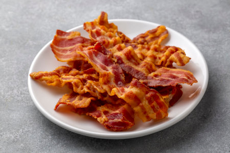 Delicious fried bacon served on plate.の写真素材