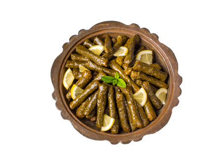 Delicious dolma (sarma) stuffed grape leaves rice. Lebanese stuffed wrap on plate. Lebanon turkish greek middle eastern cuisine. (Turkish name; Stuffed grape leaves)の写真素材
