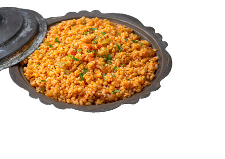 Traditional turkish bulgur pilaf with tomato sause in plate (Turkish name; meyhane pilaf)の写真素材