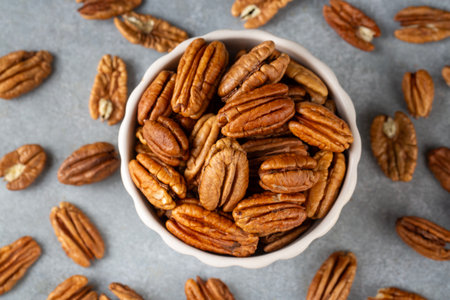 Tasty pecan nuts in bowlの写真素材