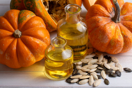 Pumpkin seed oil and fresh pumpkins.の写真素材