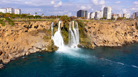 Waterfall Duden (Karpuzkaldiran selalesi) falling into the Mediterranean sea. Waterfall falling into sea. Waterfall stream. Aerial drone shooting. Antalya - Turkeyの写真素材