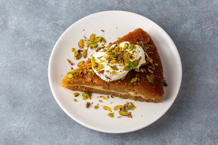 Turkish Traditional Dessert Ekmek Kadayif - Bread Pudding. Ramadan Dessert with creamの写真素材