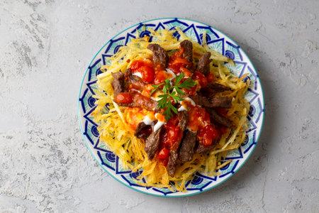 Turkish food; Cokertme Kebab - Beef meat kebab with yoghurt and french friesの写真素材