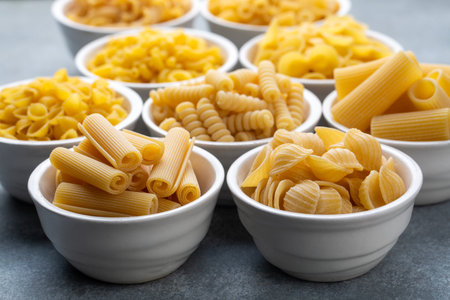 Composition with different tasty uncooked pasta - Italian pasta wallpaper, different types and shapes of pasta layoutの写真素材