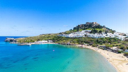 Rhodes, Greece. Lindos small whitewashed village and the Acropolis, scenery of Rhodos Island at Aegean Sea.の写真素材