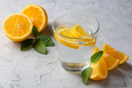 Glass of water with lemon slices - Lemon water
