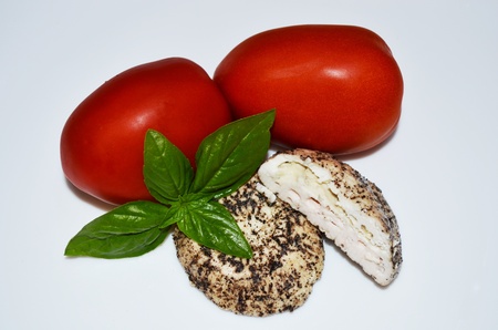 Maltese Traditional Cheese accompanied by fresh basil and Tomatoesの写真素材