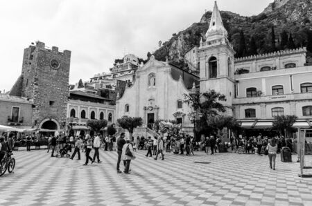 The main square of Taormina in Sicily full of restaurants and its cathedralのeditorial素材