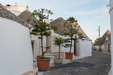 One of the main roads of the historical centre of Alberobello in Puglia, Italyの写真素材