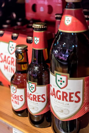 Sagres Beer Bottles in different sizes sold in a market in the centre of Lisbon, Portugalのeditorial素材