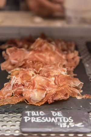 An assortment of hams in Mercado da Ribeira in Lisbon, Portugalの写真素材