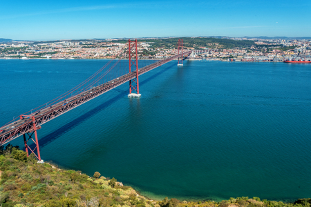 View over Tagus river and the 25th April Bridge in Lisbon, Portugalの写真素材
