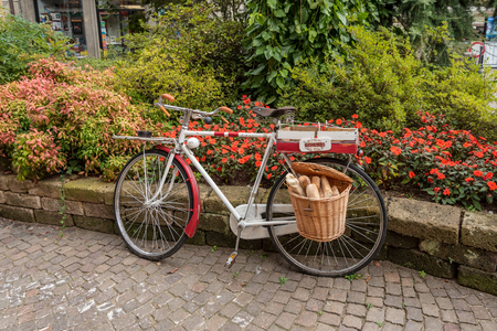 An old bicycle of a bread shop in the historical centre of Stresa, Italyの写真素材