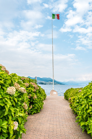Italian flag on Lago Maggiore in Stresa, Italyの写真素材
