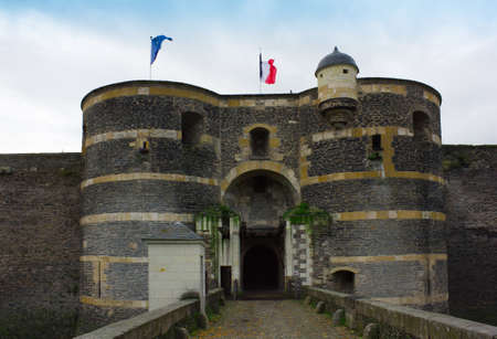 Entrance and towers of castle of Angers, France and EU banner