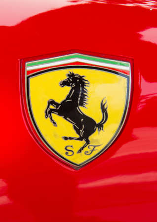 PUERTO DE LA CRUZ - JULY 14: The Cavallino Rampante, symbol of Ferrari on red luxury car at opening of Exposicion de vehiculos antiguos y clasicos, on July 14, 2013 in London. Ferrari has used the Cavallino Rampante since 1929.のeditorial素材