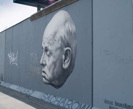 BERLIN, GERMANY - CIRCA JUNE 2013 - Part of the East Side Gallery famous graffiti of academician...