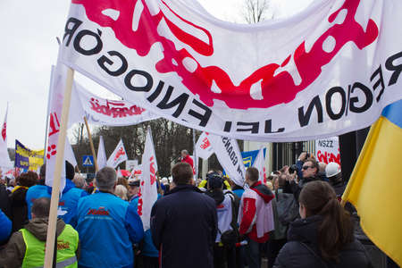 WARSAW - MARCH 8: Protesters rally near russian embassy against invasion to Crimea, Ukraine during an event organized by Solidarity trade union in Warsaw, Poland on March 8, 2014のeditorial素材