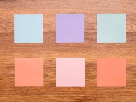 Several note stickers on the wooden floor
