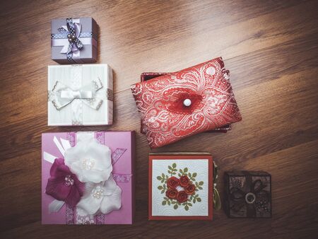 Top view on several gift boxes on the wooden floorの写真素材