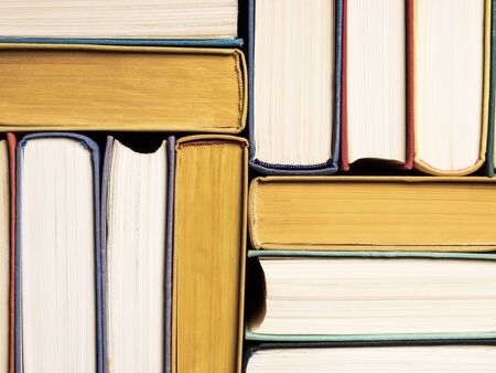 Pile of old books on the table. Background image