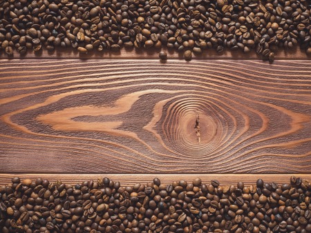Multiply coffee beans on the wooden table. Top viewの写真素材