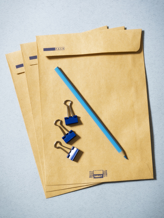 Some envelopes and pencil on the table. Top viewの写真素材