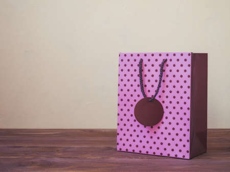 Gift package standing on the wooden tableの写真素材