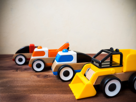 Toy machinery on the wooden floor. Side viewの写真素材