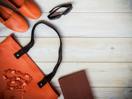 Beach accessories on wooden background. Holidays concept. View from aboveの写真素材