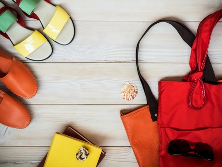Beach accessories on wooden background. Holidays concept. View from aboveの写真素材