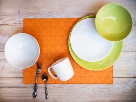 Collection of plates and bowls on the table. View from aboveの写真素材