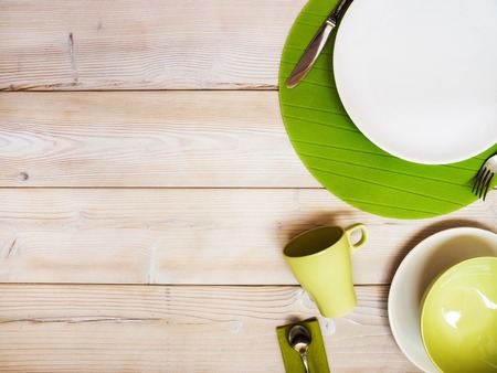 Collection of plates and bowls on the table. View from aboveの写真素材