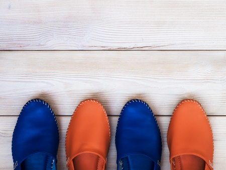 Summer clothes on wooden background. View from aboveの写真素材