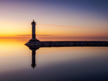 Beacon on the shore of Lake Ladoga in the evening twilightの写真素材