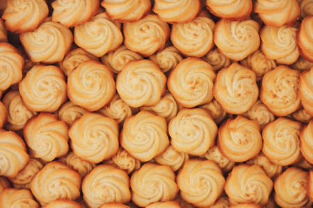 Background texture of small cookies in the shape of flowers.の写真素材