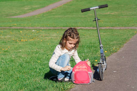 Girl and scooterの写真素材